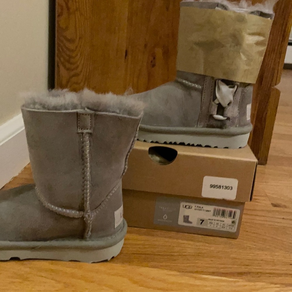 Never worn girls grey UGG boots, lace up with bow on side